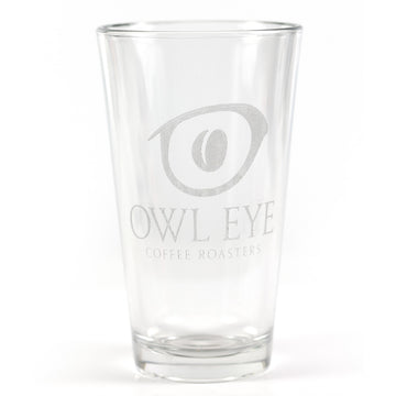 Clear pint glass etched with the Owl Eye Coffee Roasters logo